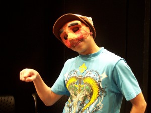 Carlos in the Mask Unit Presentation of the Teen Ensemble